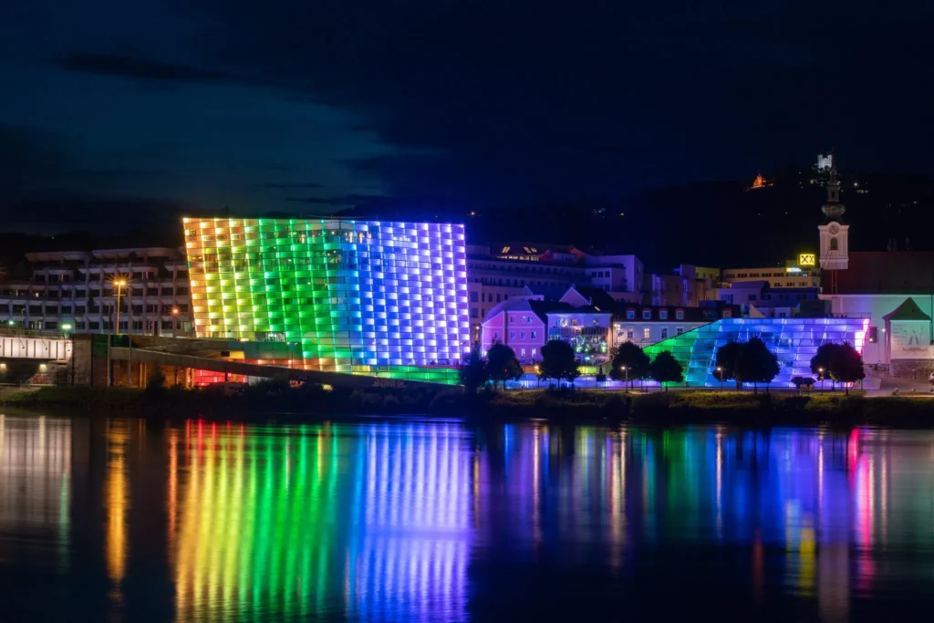 Colourful illuminated façade of Ars Electronica Center Linz Austria